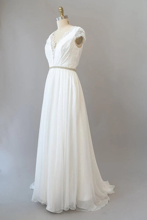 Elegant V-neck lace and chiffon wedding dress with cap sleeves.