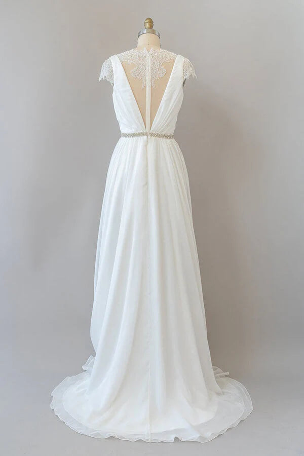 Back view of sheath wedding gown with flowing chiffon skirt.