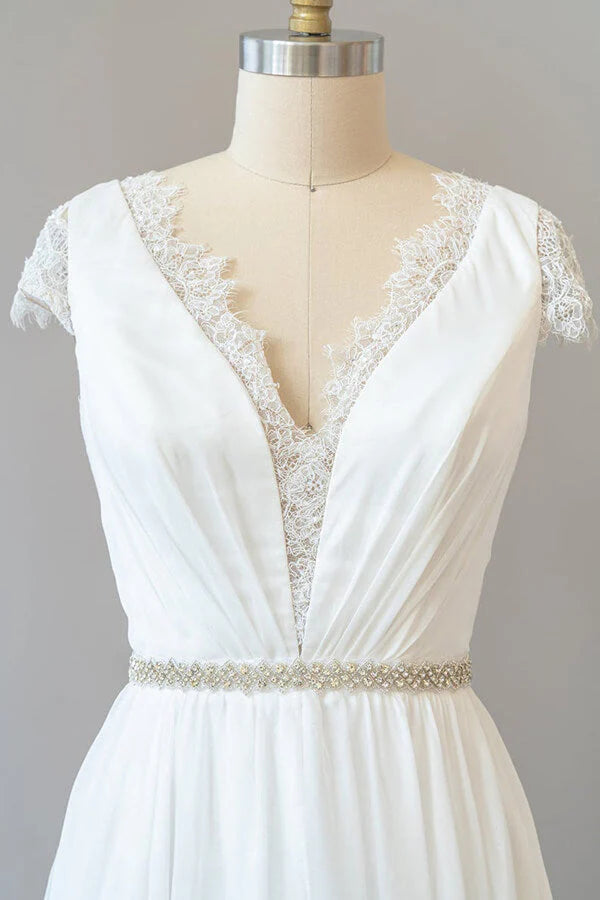 Close-up of lace bodice and V-neckline on wedding dress.