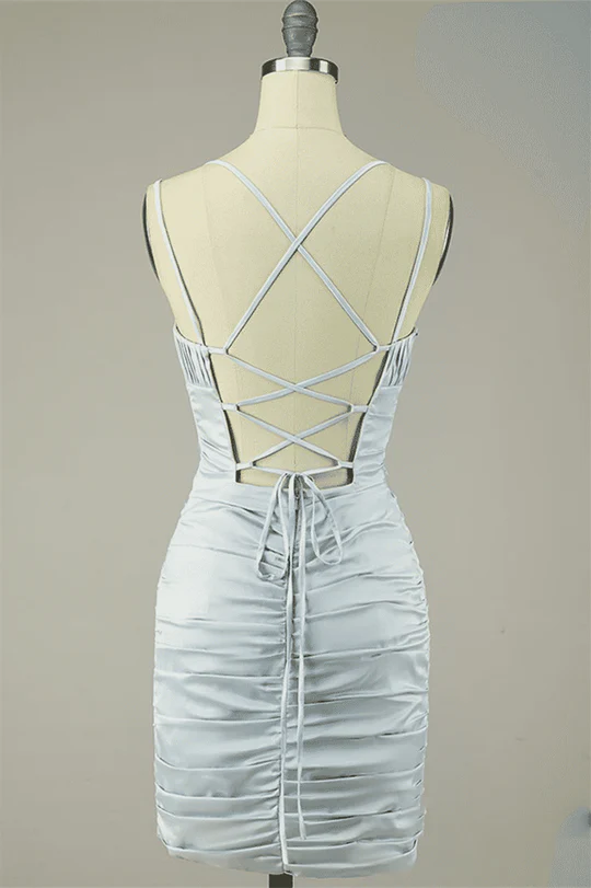 Side view of pleated satin homecoming dress.