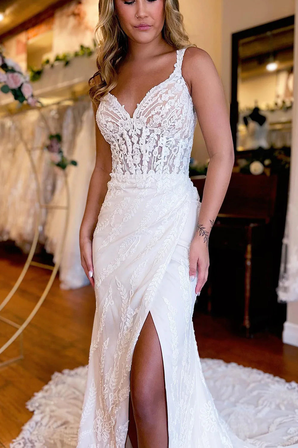 Back view of the sheath wedding dress, highlighting lace details.