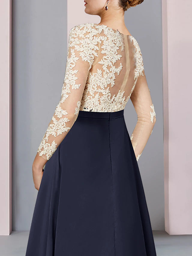 Close-up of chiffon lace and pleat details on the elegant dress.