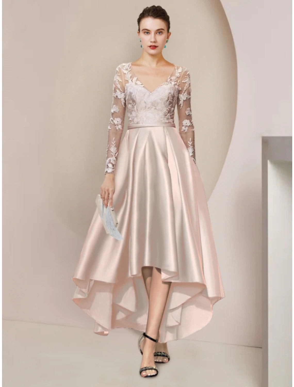 Woman wearing an elegant sheath V-neck long sleeve satin Mother of the Bride dress.