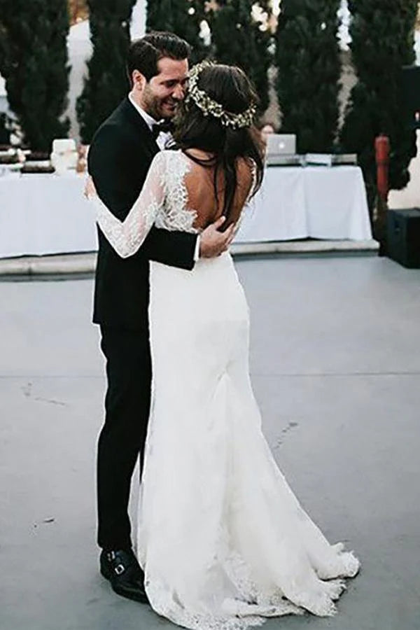Backless design of the sheath wedding dress with delicate appliques.
