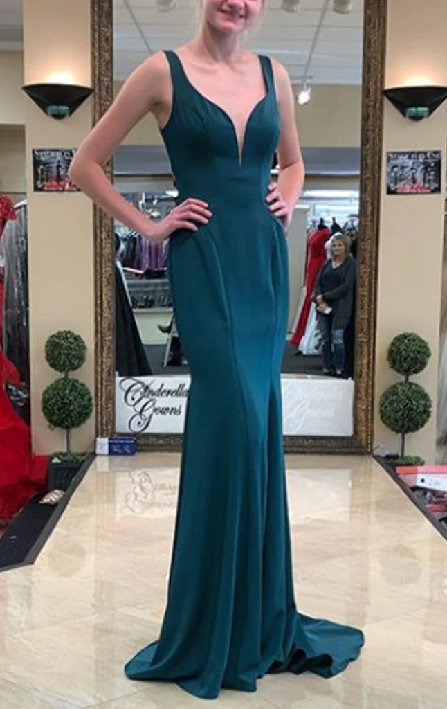 Model wearing an elegant V-neck sheath maxi gown.