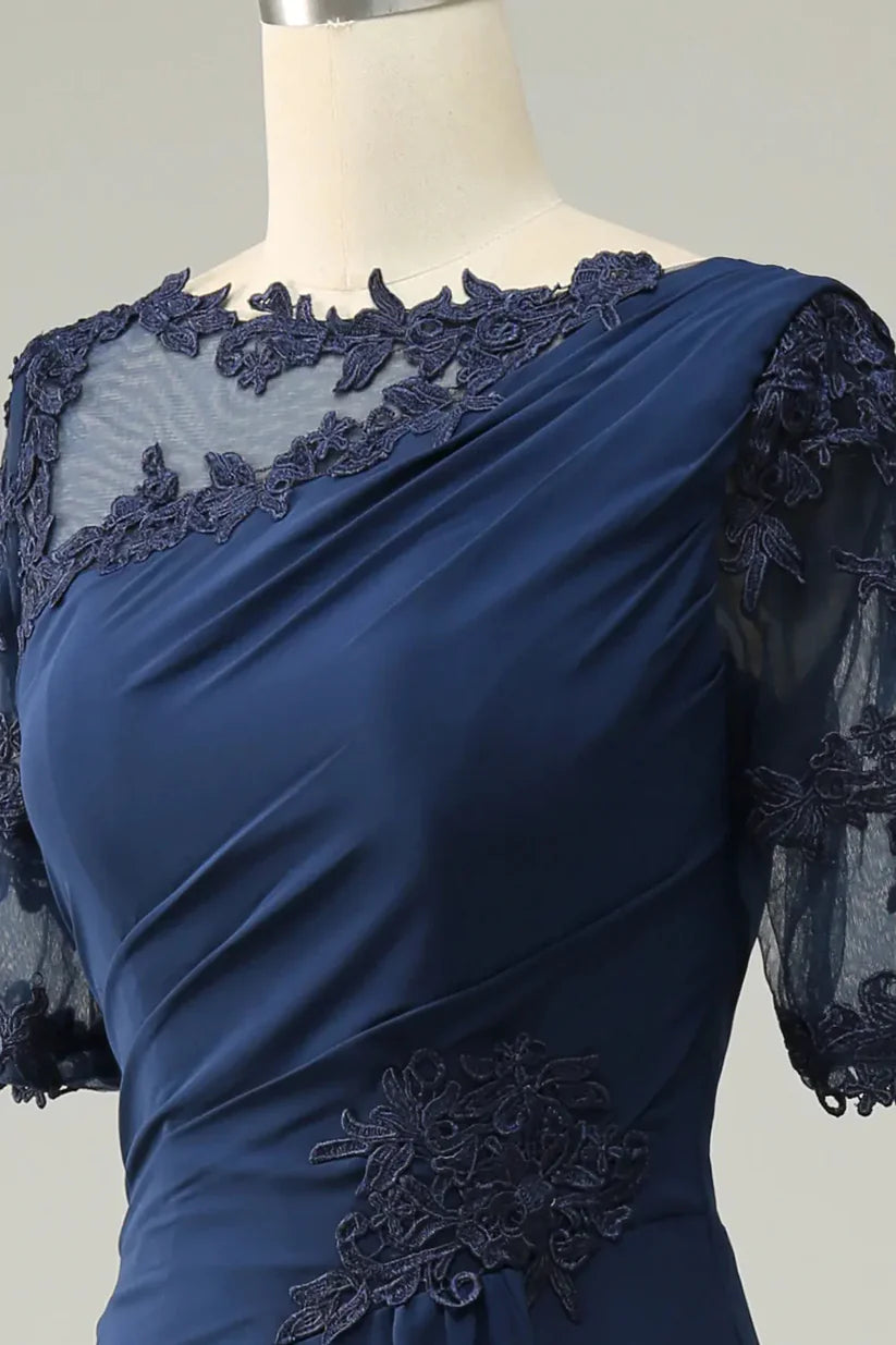 Close-up of appliques on the elegant sheath mother of the bride dress.