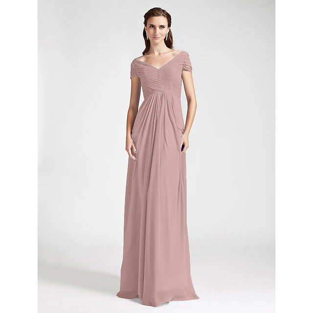 Back view of a floor-length bridesmaid dress showing open back with criss-cross draping.