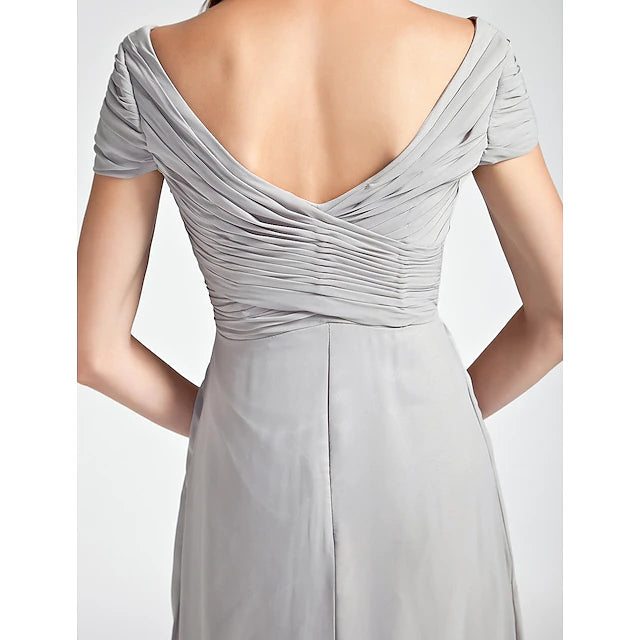 Close-up of the V-neck and off-shoulder detail on a bridesmaid gown.