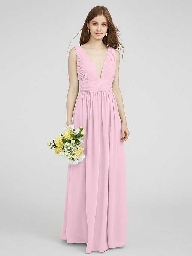 Side profile of a V-neck chiffon gown with draping.