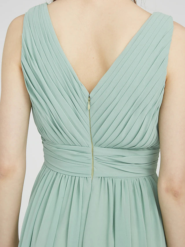 Detail of the side draping on an elegant V-neck dress.
