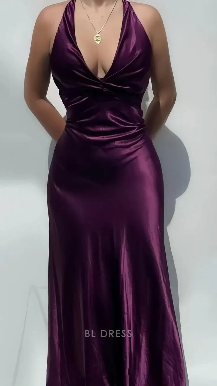 Woman wearing an elegant V-neck sheath satin maxi dress with a side slit.