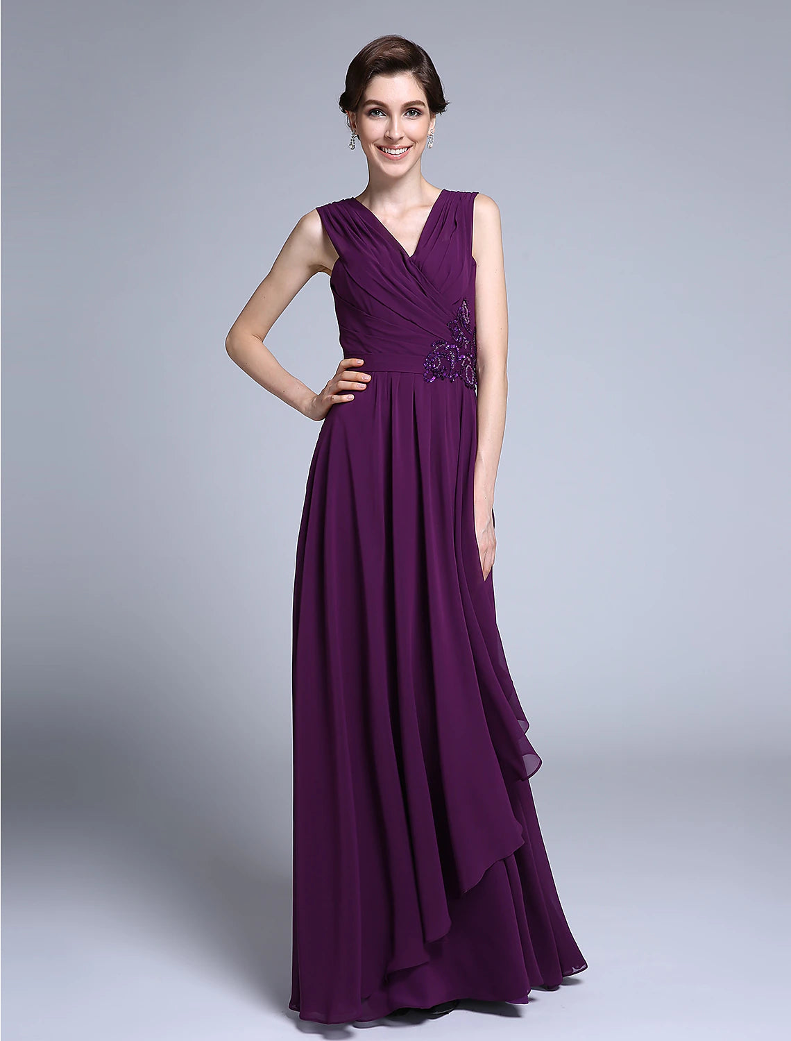 Elegant navy blue sheath V-neck gown with sequin details.