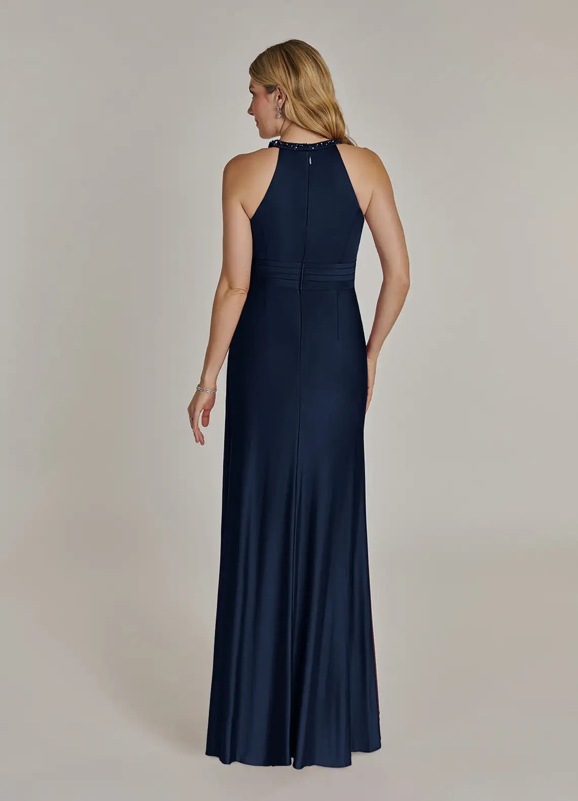 Back view of Dark Navy Sheath dress with V-neck and flowing chiffon.