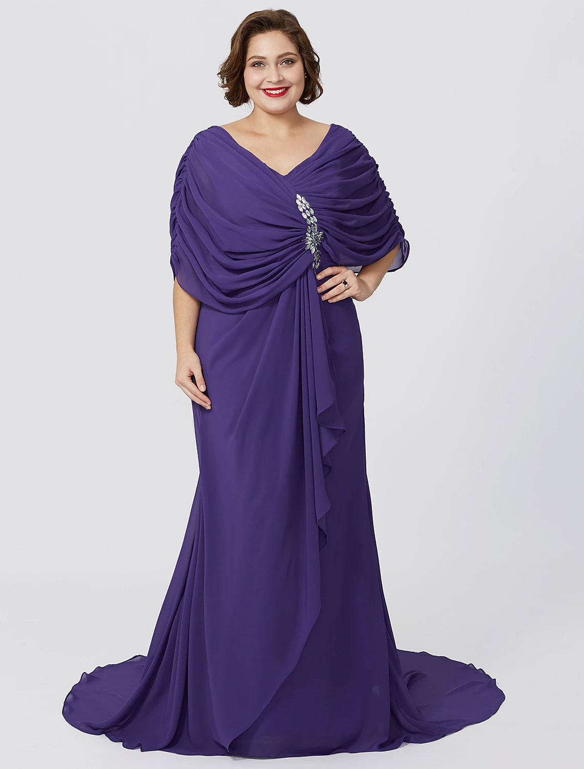 Side view of the flowing chiffon mother of the bride gown.