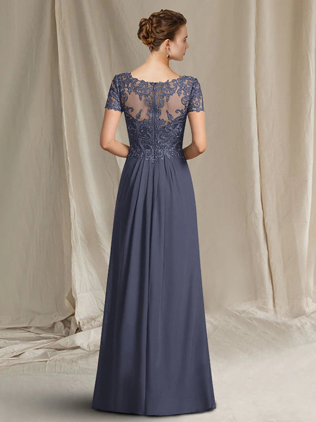 Back view of a floor-length sheath gown featuring lace appliques.