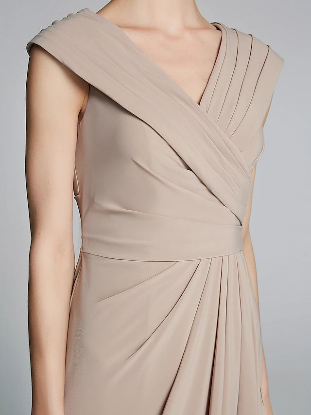 Woman posing gracefully in the V-neck Mother of the Bride gown.