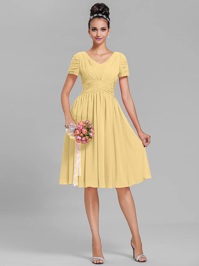 Back view of a ruched chiffon bridesmaid dress with short sleeves.