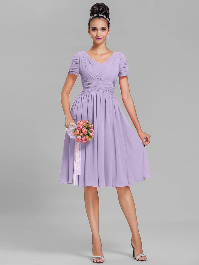 Side profile of a vintage-inspired V-neck bridesmaid gown.