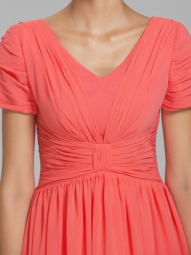 Full length view of a short sleeve knee-length formal dress.