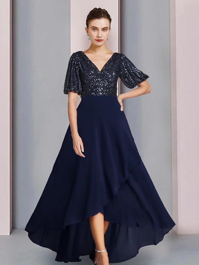 Back view of sequined chiffon sheath dress with pleats.