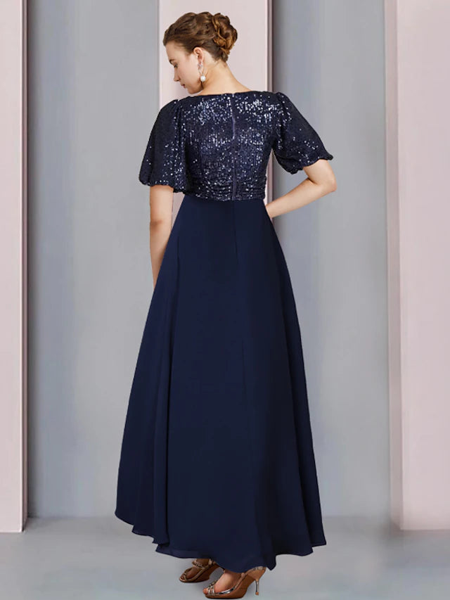 Side view of asymmetrical V-neck short sleeve dress.