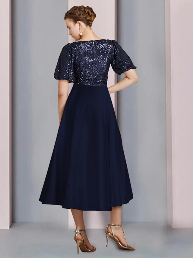 Close-up of sequin and chiffon fabric on the dress.