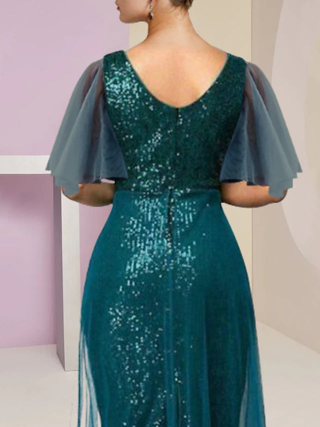 Back view of a sequined mother of the bride dress with high-low hem.