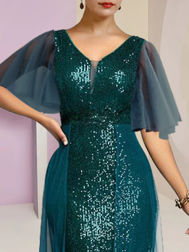 Side view of a formal V-neck sequined dress with pleats.