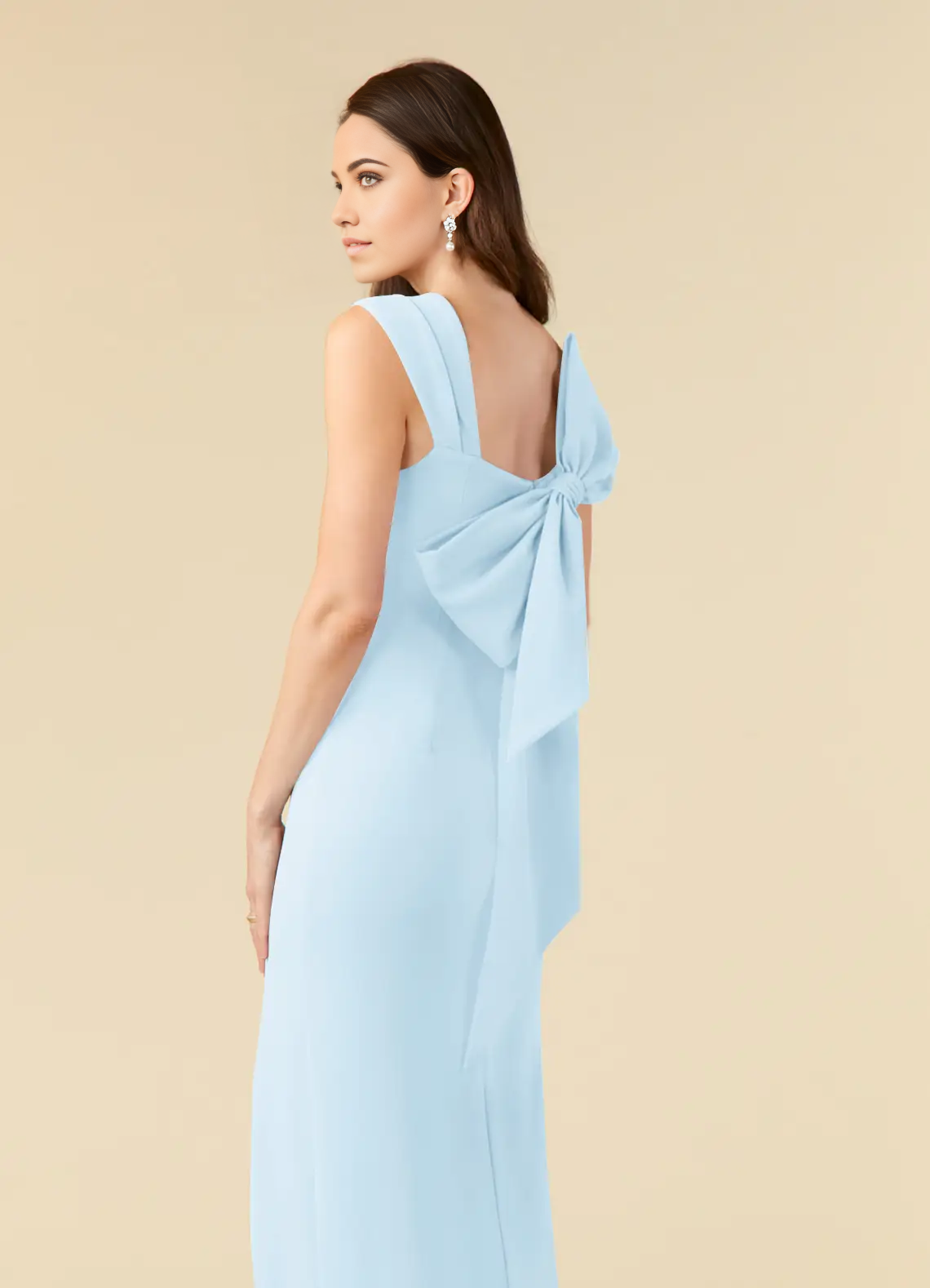 Side view of a woman in a sky blue V-neck sheath dress, showcasing the side slit.