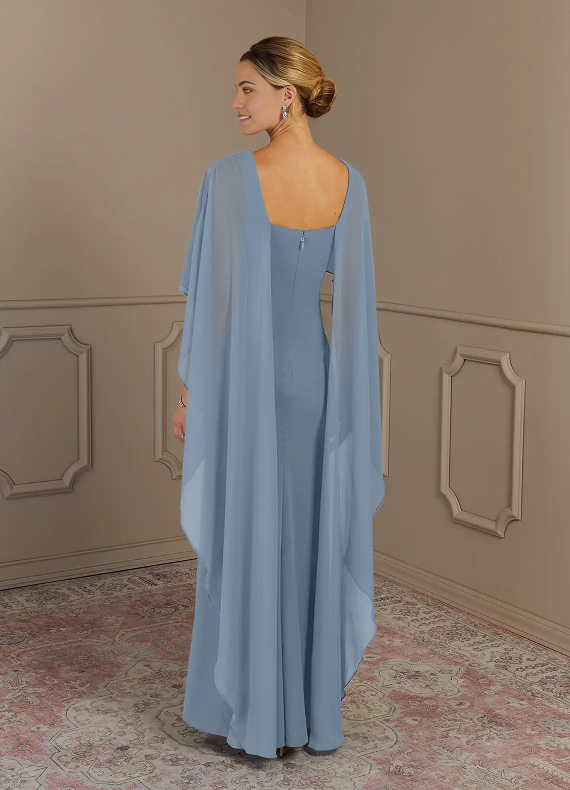 Close-up of the fabric and V-neckline of the dusty blue dress.