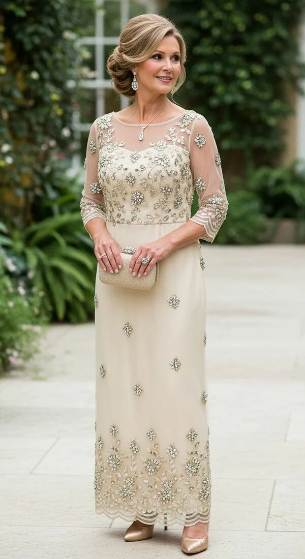 Champagne sheath dress with lace, beads, and appliques, featuring a V-neck and long skirt.