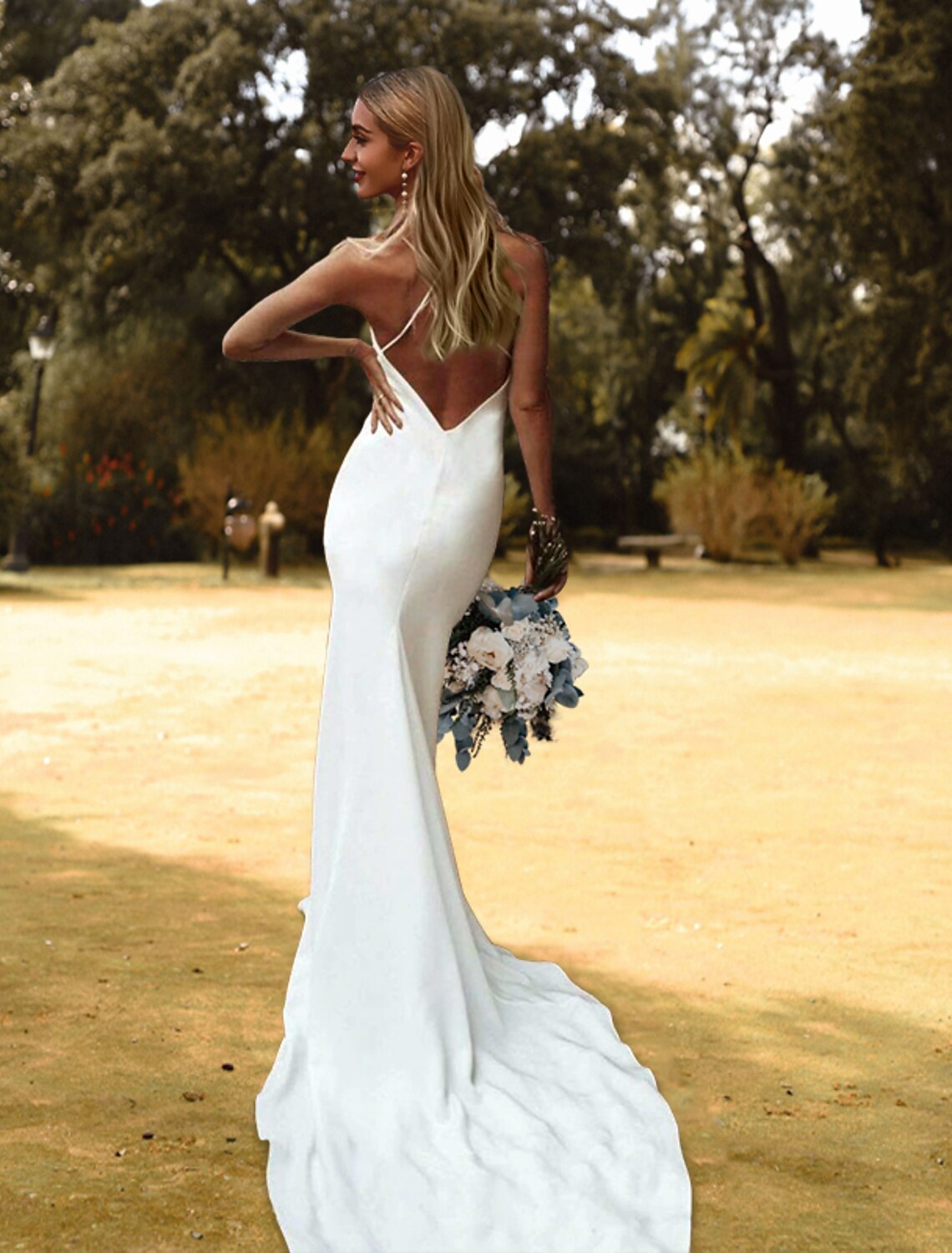 Back view of a charmeuse sheath wedding dress showing the court train.
