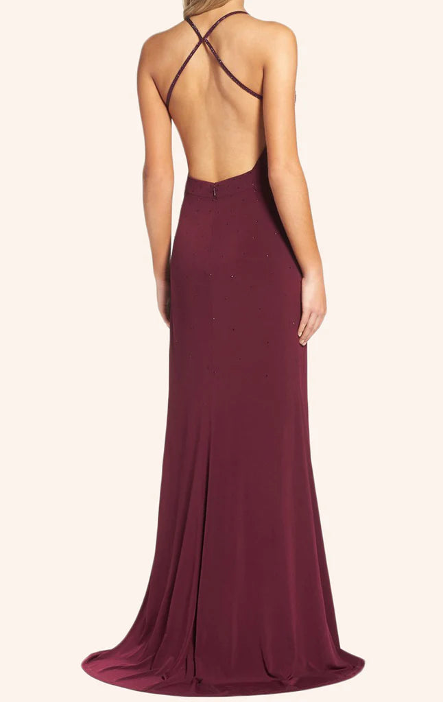 Elegant V-neck sheath formal gown with spaghetti straps on a model.