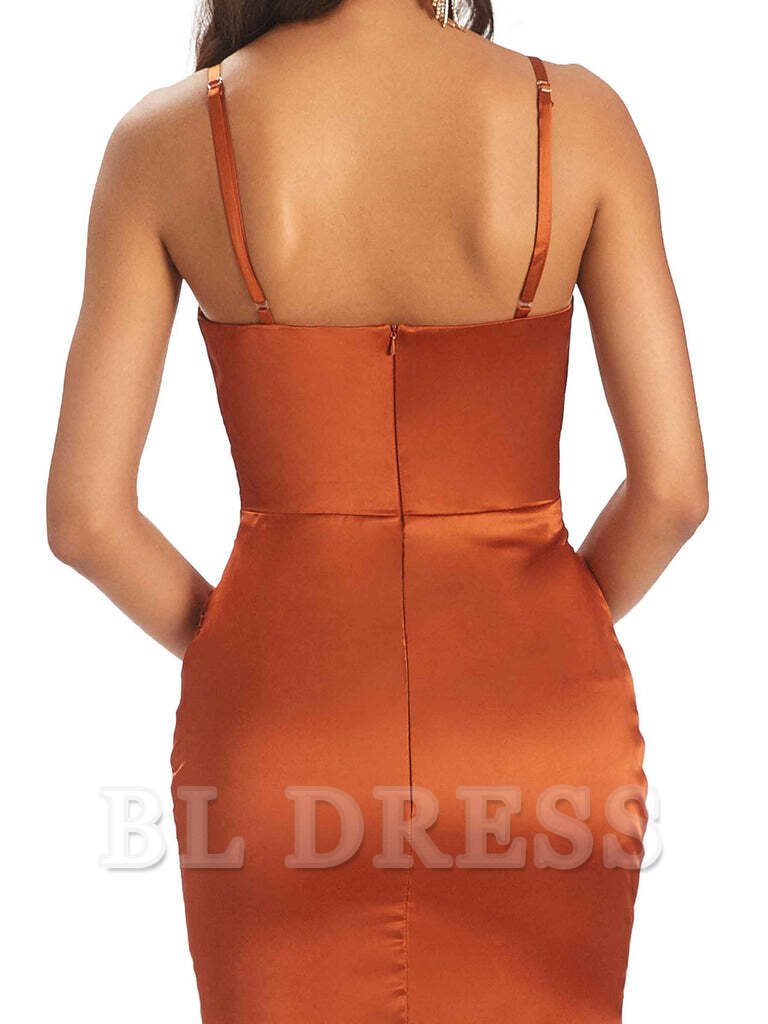 Close-up of the V-neckline and delicate spaghetti straps on the satin dress.