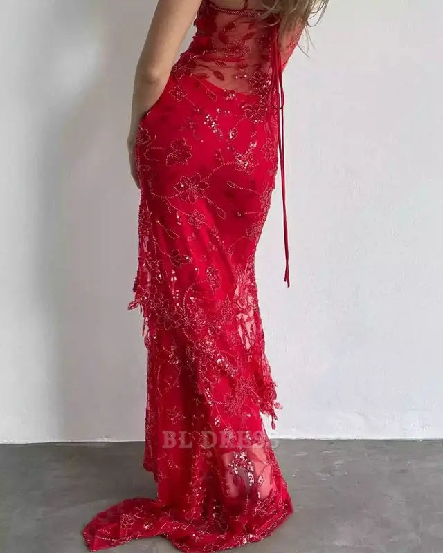 Full length view of a woman wearing a red sheath prom dress.