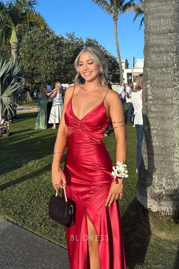 Elegant red satin sheath maxi dress with V-neck, spaghetti straps, and a high leg slit.