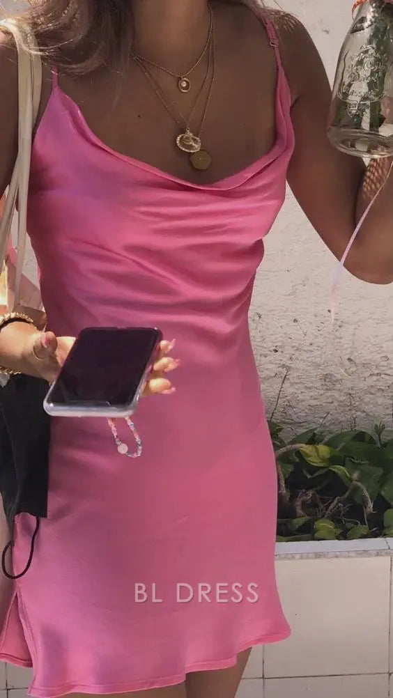 Woman wearing a pink sheath mini dress with V-neck and delicate straps.