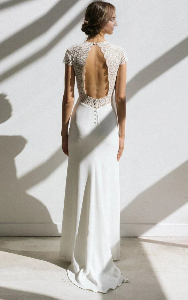 Back view of the white sheath V-neck short sleeve chiffon wedding dress, showing the sweep train.