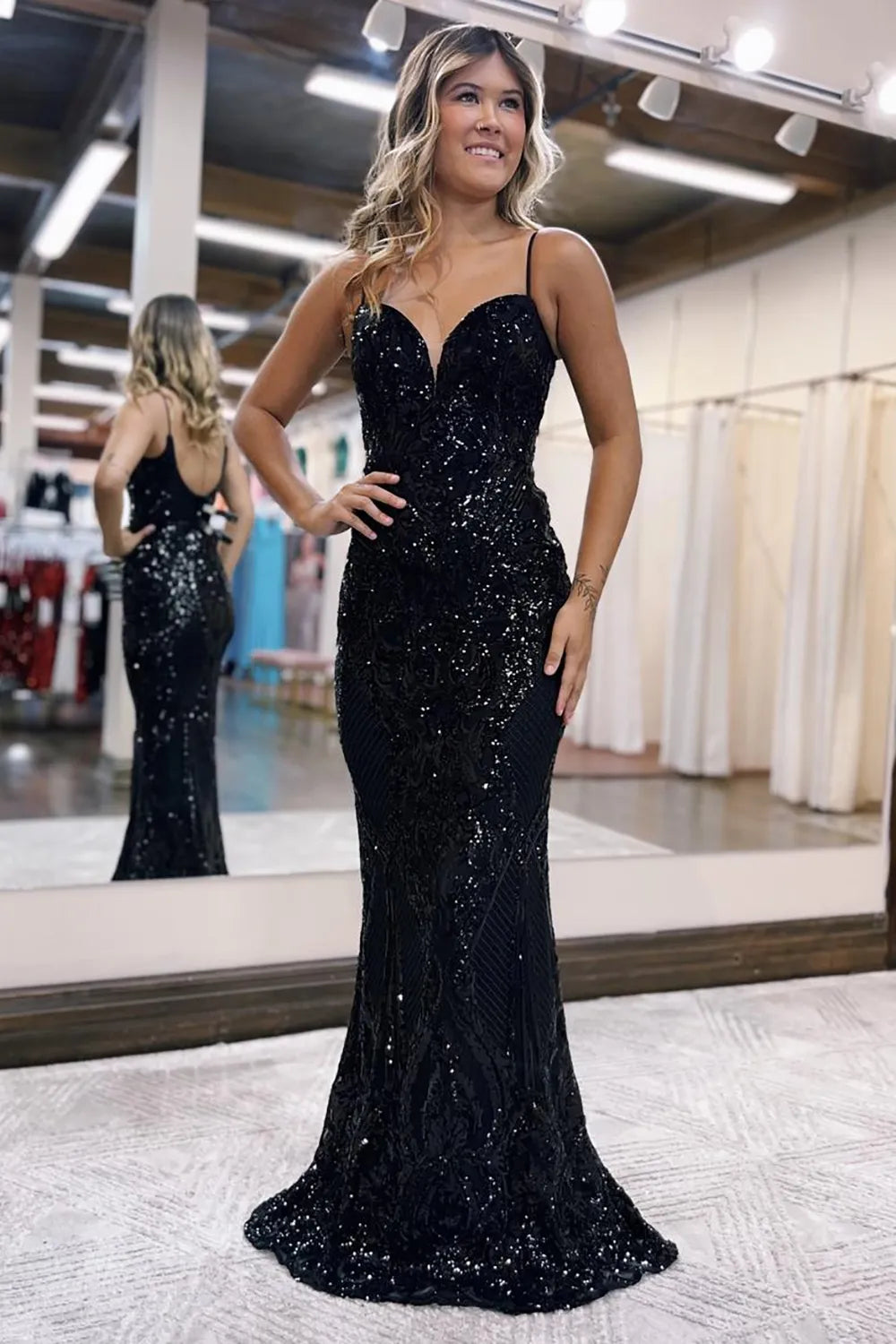 Close-up of the glitter fabric on a mermaid prom dress.
