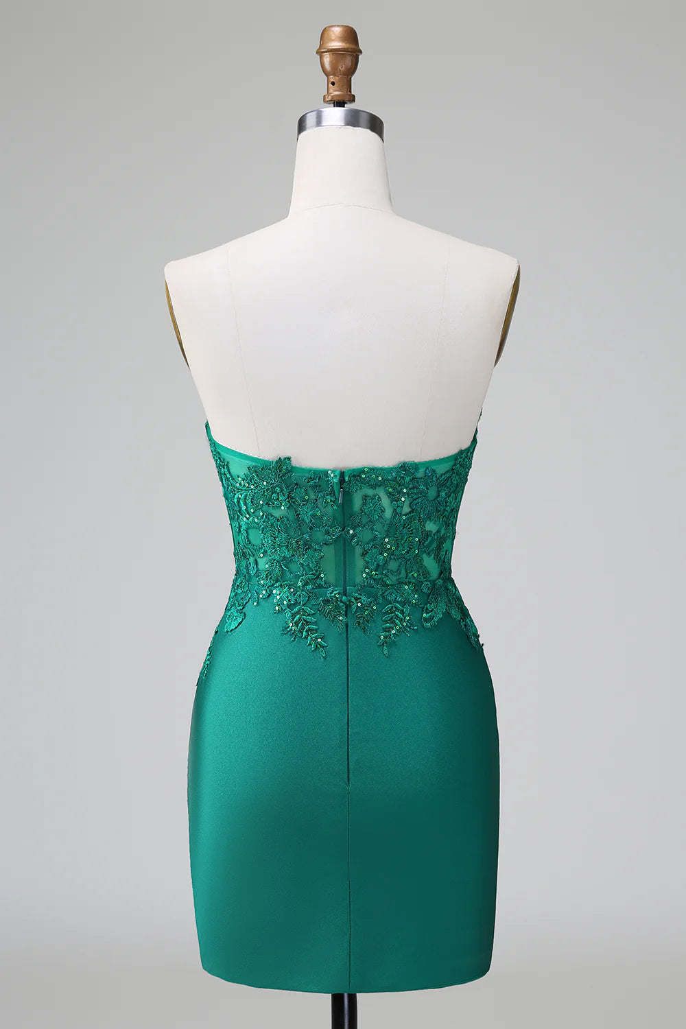 Back view of a short formal dress featuring glitter and beaded details.