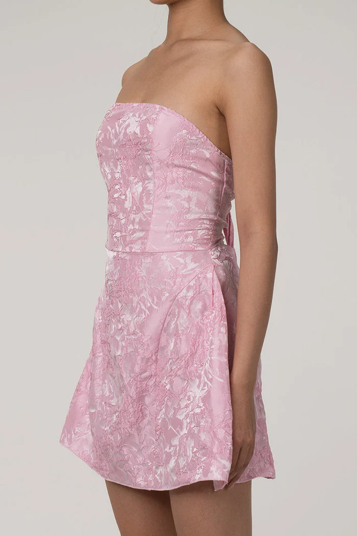 Side view of the strapless floral jacquard mini dress.