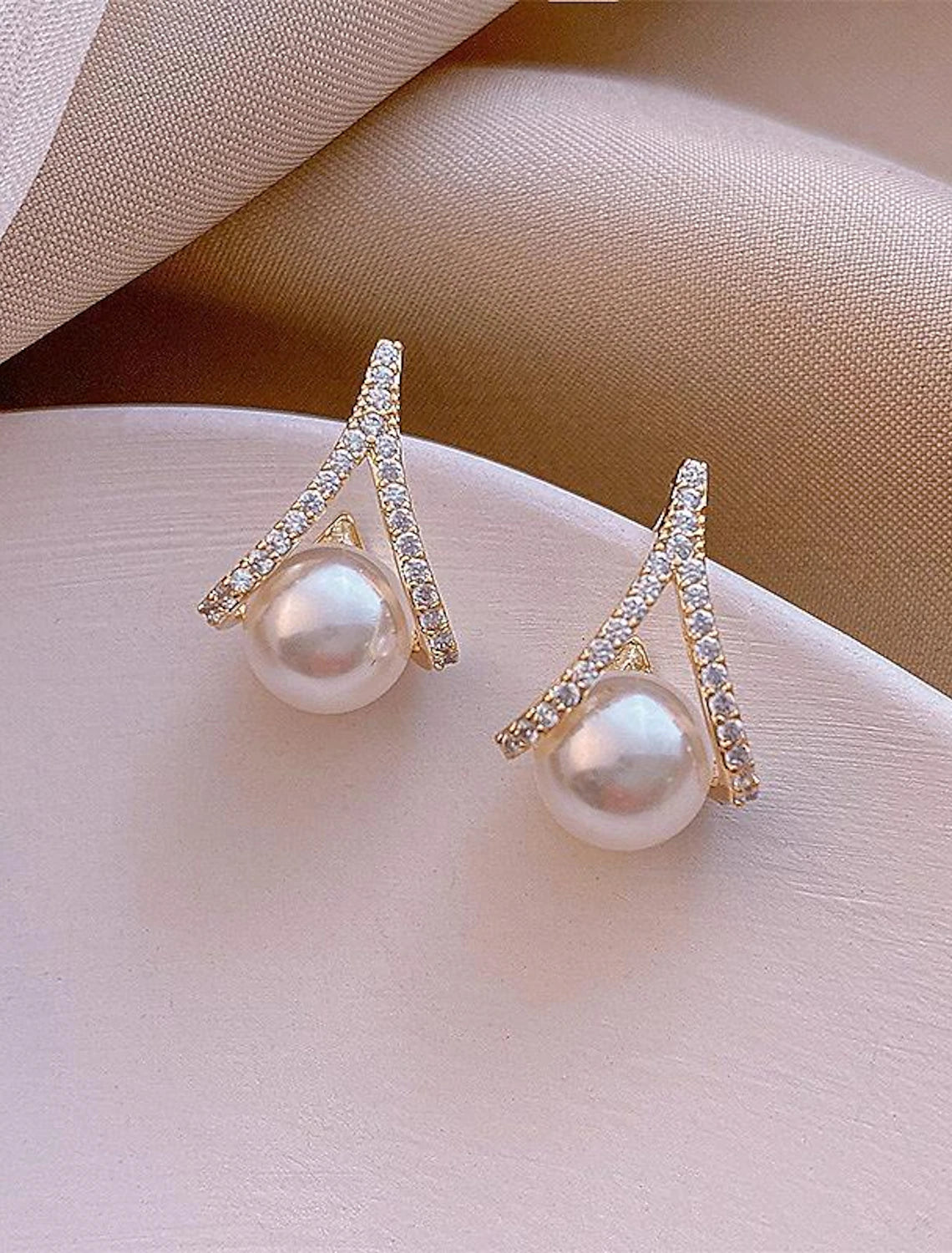 Close-up of a single elegant silver pearl stud earring.