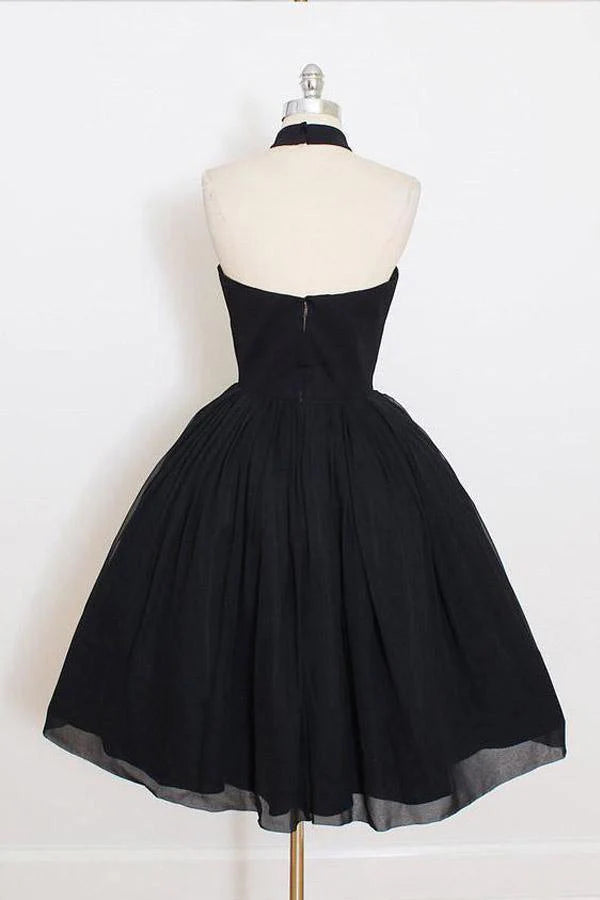 Side view of a black halter short homecoming dress.
