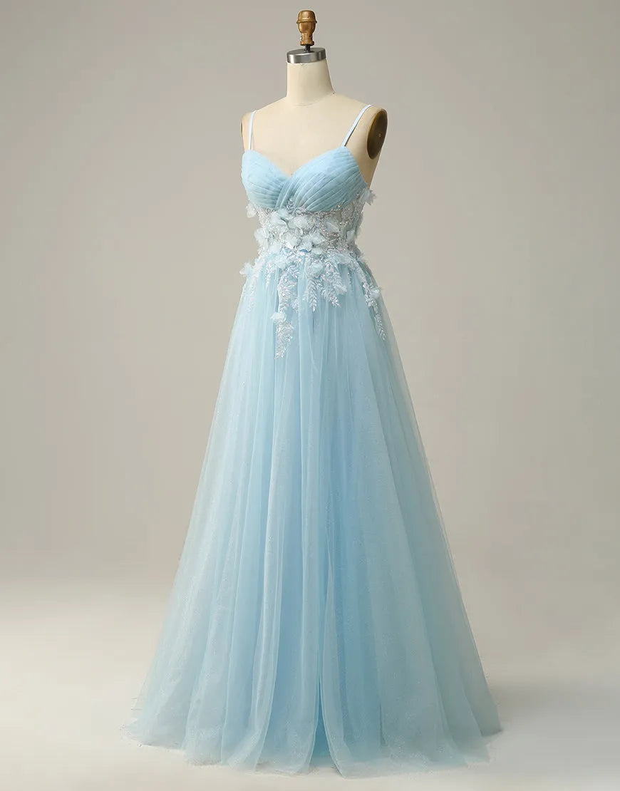 Close-up of 3D appliques on sky blue tulle prom dress.