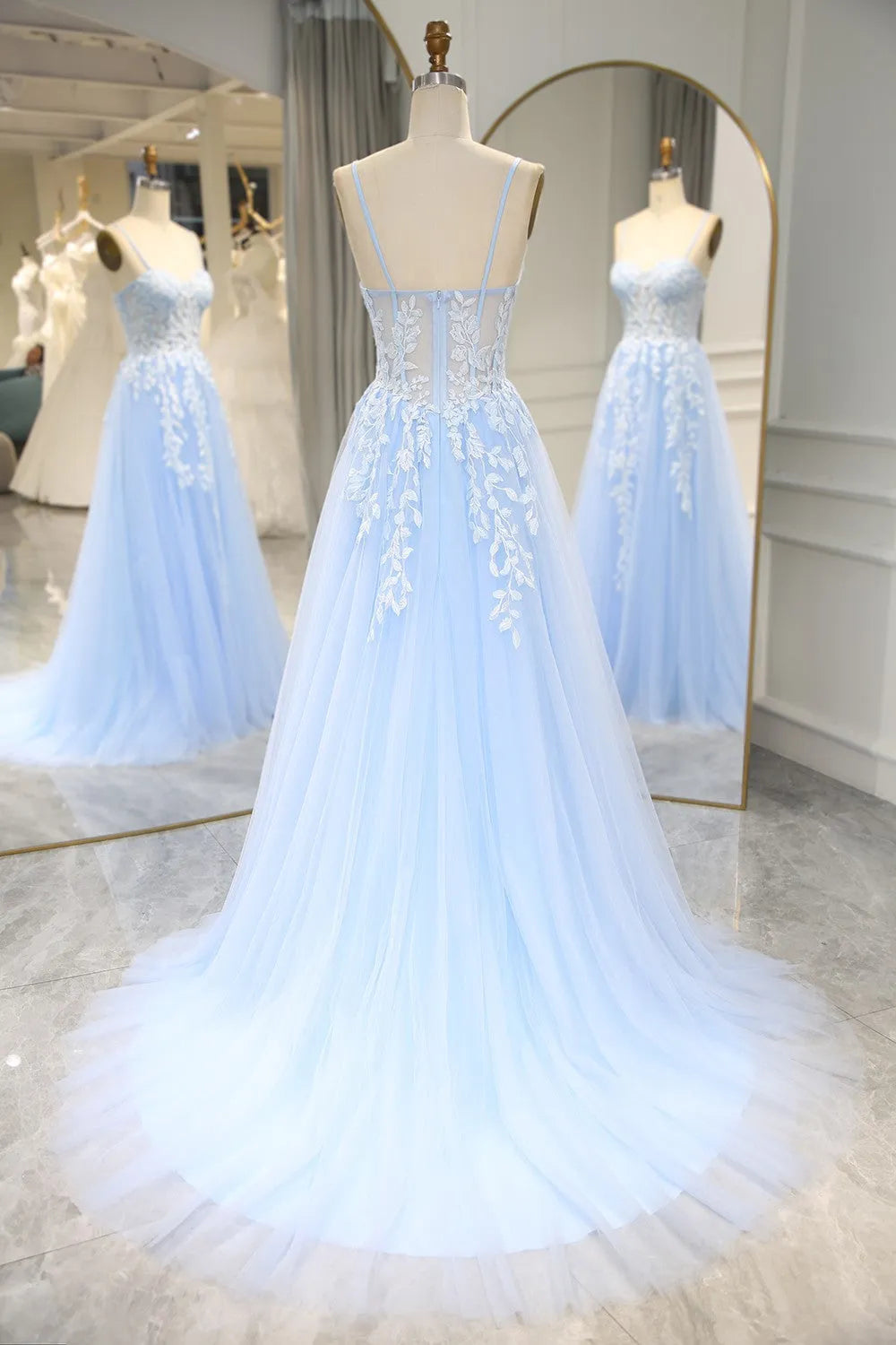 Side view of the sky blue mermaid prom dress, highlighting appliques.