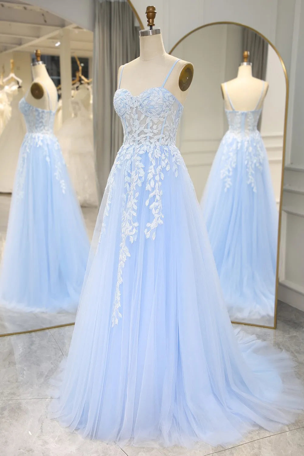 Back view of the elegant sky blue mermaid gown with a flowing train.