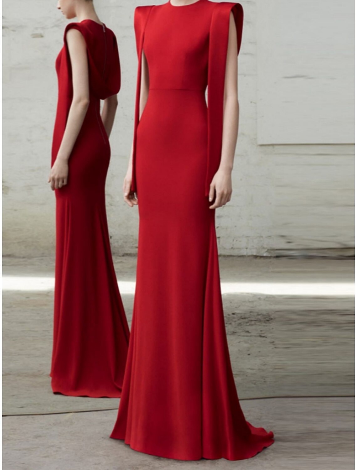 Close-up of the red stretch fabric with pleats on the mermaid evening dress.