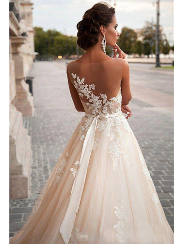 Close-up of the delicate appliques on the satin wedding dress.