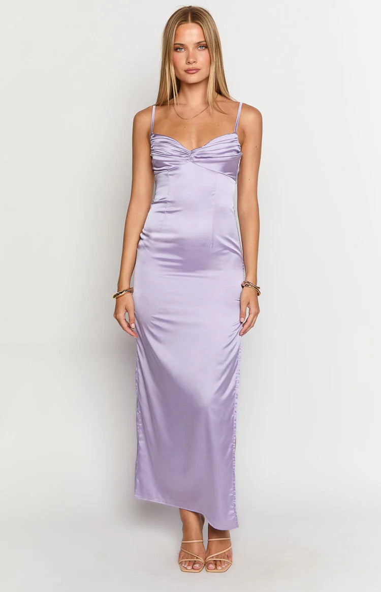 Full-length view of a woman in the elegant satin prom dress, emphasizing its graceful drape.