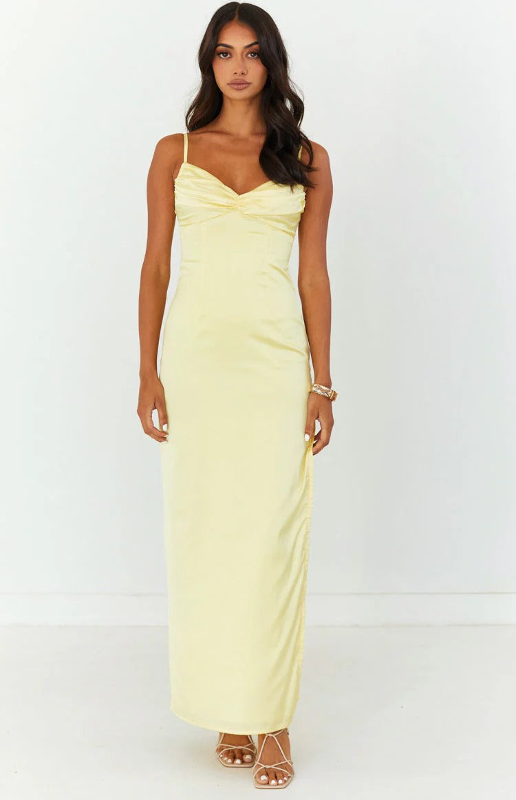 Woman walking in the floor-length satin dress, showcasing its movement and high slit.